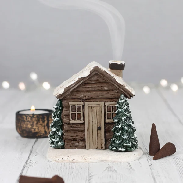 Winter log cabin kegelbrander
